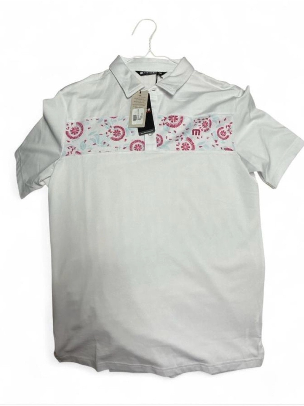 Travis Mathew White Polo with Pink Floral Chest Band